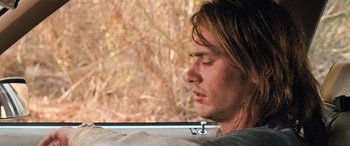 Movie still from “Pineapple Express” (2008), directed by David Gordon Green – A person sitting in a car; Close Up shot, Over the shoulder angle