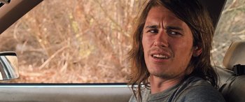 Movie still from “Pineapple Express” (2008), directed by David Gordon Green – A person sitting in a car; Close Up shot, Over the shoulder angle
