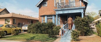 Movie still from “Pineapple Express” (2008), directed by David Gordon Green – A man walking down the steps of a house; Extreme Wide shot, High angle