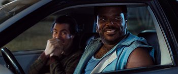 Movie still from “Pineapple Express” (2008), directed by David Gordon Green – Two men sitting in the back seat of a car; Close Up shot, Over the shoulder angle
