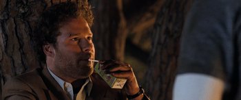 Movie still from “Pineapple Express” (2008), directed by David Gordon Green – A person holding a box of food; Close Up shot, Over the shoulder angle