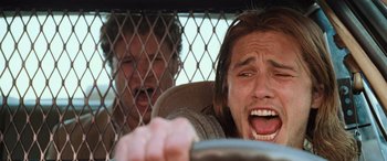 Movie still from “Pineapple Express” (2008), directed by David Gordon Green – Two men in the back seat of a car; Close Up shot, Low angle