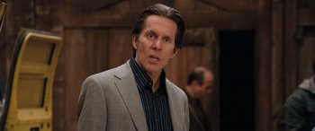 Movie still from “Pineapple Express” (2008), directed by David Gordon Green – A person wearing a suit and tie; Close Up shot, Over the shoulder angle