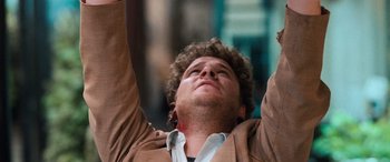 Movie still from “Pineapple Express” (2008), directed by David Gordon Green – A man with his hands raised in the air; Close Up shot, Overhead angle