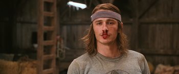 Movie still from “Pineapple Express” (2008), directed by David Gordon Green – A man with a bandage around his mouth and nose; Close Up shot, Low angle