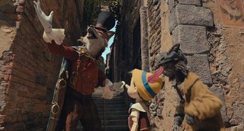 Movie still from “Pinocchio” (2022), directed by Robert Zemeckis – A group of people standing next to each other on a street; Wide shot, Low angle