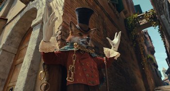 Movie still from “Pinocchio” (2022), directed by Robert Zemeckis – A statue of a fox wearing a top hat; Medium shot, Low angle