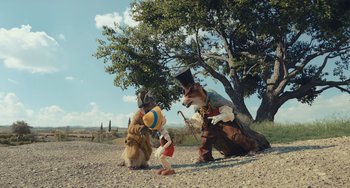 Movie still from “Pinocchio” (2022), directed by Robert Zemeckis – A group of people dressed up like characters; Wide shot, High angle