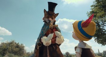 Movie still from “Pinocchio” (2022), directed by Robert Zemeckis – A dog wearing a top hat and a cape; Medium shot, Low angle