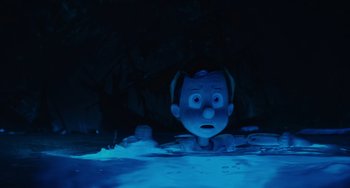 Movie still from “Pinocchio” (2022), directed by Robert Zemeckis – The head of a cartoon character in the water; Close Up shot, High angle