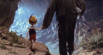 Movie still from “Pinocchio” (2022), directed by Robert Zemeckis – A man and a child are walking on a cliff; Wide shot, High angle