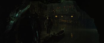 Movie still from “Pirates of the Caribbean: At World's End” (2007), directed by Gore Verbinski – A man standing next to a boat in the water; Wide shot, High angle