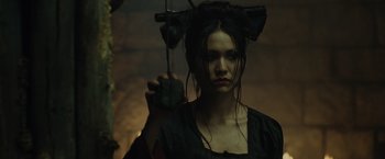 Movie still from “Pirates of the Caribbean: At World's End” (2007), directed by Gore Verbinski – A young woman with long black hair holding a hairbrush; Close Up shot, Low angle