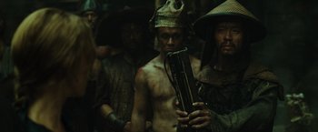Movie still from “Pirates of the Caribbean: At World's End” (2007), directed by Gore Verbinski – A group of men standing next to each other; Medium shot, Low angle