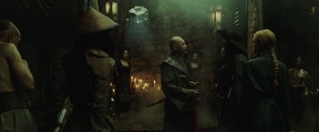 Movie still from “Pirates of the Caribbean: At World's End” (2007), directed by Gore Verbinski – A group of people standing around in a room; Medium shot, Over the shoulder angle