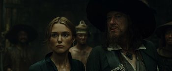 Movie still from “Pirates of the Caribbean: At World's End” (2007), directed by Gore Verbinski – A man and a woman standing next to each other in a room; Close Up shot, Over the shoulder angle