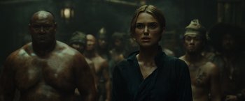 Movie still from “Pirates of the Caribbean: At World's End” (2007), directed by Gore Verbinski – A person in front of a group of people; Close Up shot, Over the shoulder angle