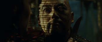 Movie still from “Pirates of the Caribbean: At World's End” (2007), directed by Gore Verbinski – A person with a beard; Close Up shot, Over the shoulder angle