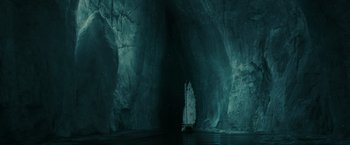 Movie still from “Pirates of the Caribbean: At World's End” (2007), directed by Gore Verbinski – A boat in the middle of a dark cave; Extreme Wide shot, High angle