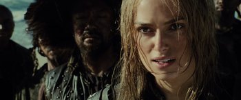 Movie still from “Pirates of the Caribbean: At World's End” (2007), directed by Gore Verbinski – A person with long blonde hair; Close Up shot, Over the shoulder angle