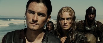 Movie still from “Pirates of the Caribbean: At World's End” (2007), directed by Gore Verbinski – A man and a woman standing next to each other; Close Up shot, Low angle