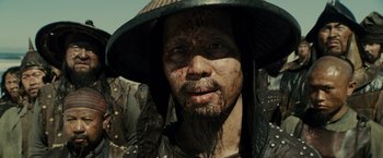 Movie still from “Pirates of the Caribbean: At World's End” (2007), directed by Gore Verbinski – A person wearing a hat; Close Up shot, Over the shoulder angle