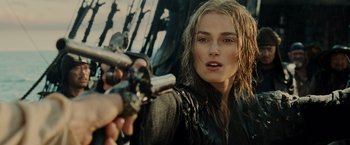 Movie still from “Pirates of the Caribbean: At World's End” (2007), directed by Gore Verbinski – A person holding a gun; Close Up shot, Over the shoulder angle