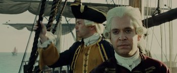 Movie still from “Pirates of the Caribbean: At World's End” (2007), directed by Gore Verbinski – Two men dressed in period costumes on a boat; Close Up shot, Over the shoulder angle