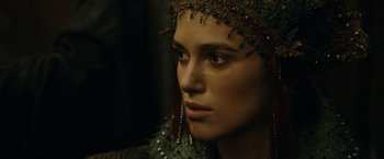 Movie still from “Pirates of the Caribbean: At World's End” (2007), directed by Gore Verbinski – A person wearing a headdress; Close Up shot, Over the shoulder angle