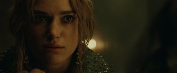 Movie still from “Pirates of the Caribbean: At World's End” (2007), directed by Gore Verbinski – A woman's face with lights in the background; Close Up shot, Over the shoulder angle