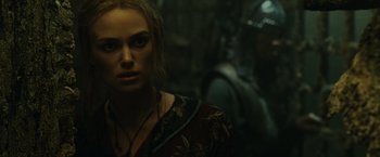 Movie still from “Pirates of the Caribbean: At World's End” (2007), directed by Gore Verbinski – A person wearing a necklace; Close Up shot, Over the shoulder angle