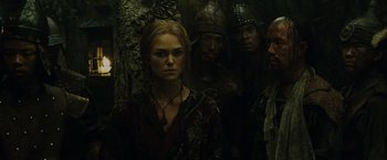 Movie still from “Pirates of the Caribbean: At World's End” (2007), directed by Gore Verbinski – A group of people standing next to each other in a forest; Medium shot, Over the shoulder angle