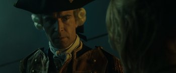 Movie still from “Pirates of the Caribbean: At World's End” (2007), directed by Gore Verbinski – A person wearing a hat; Close Up shot, Over the shoulder angle