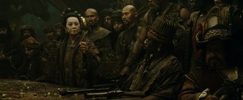 Movie still from “Pirates of the Caribbean: At World's End” (2007), directed by Gore Verbinski – A group of men and women standing next to each other; Medium shot, Over the shoulder angle