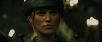 Movie still from “Pirates of the Caribbean: At World's End” (2007), directed by Gore Verbinski – A person wearing a hat; Close Up shot, Over the shoulder angle