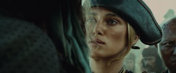 Movie still from “Pirates of the Caribbean: At World's End” (2007), directed by Gore Verbinski – A woman's face with a cigarette in her mouth; Close Up shot, Over the shoulder angle