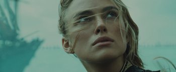 Movie still from “Pirates of the Caribbean: At World's End” (2007), directed by Gore Verbinski – A woman's face with long blonde hair; Close Up shot, Low angle