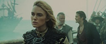 Movie still from “Pirates of the Caribbean: At World's End” (2007), directed by Gore Verbinski – A man and a woman are standing next to each other; Close Up shot, Over the shoulder angle