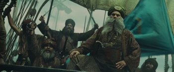 Movie still from “Pirates of the Caribbean: At World's End” (2007), directed by Gore Verbinski – Two men in medieval garb holding an umbrella; Medium shot, Low angle