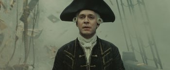 Movie still from “Pirates of the Caribbean: At World's End” (2007), directed by Gore Verbinski – A man wearing a pirate hat and a black coat; Close Up shot, Low angle