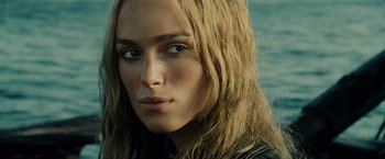 Movie still from “Pirates of the Caribbean: At World's End” (2007), directed by Gore Verbinski – A person with long blonde hair; Close Up shot, Over the shoulder angle