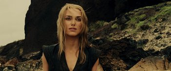 Movie still from “Pirates of the Caribbean: At World's End” (2007), directed by Gore Verbinski – A woman with long blonde hair standing in front of a cliff; Close Up shot, Over the shoulder angle