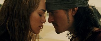 Movie still from “Pirates of the Caribbean: At World's End” (2007), directed by Gore Verbinski – A man and a woman face to face with their eyes closed; Close Up shot, Low angle