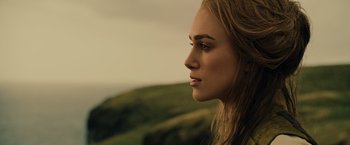 Movie still from “Pirates of the Caribbean: At World's End” (2007), directed by Gore Verbinski – A beautiful young woman with long blonde hair; Close Up shot, Low angle