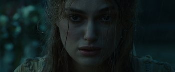 Movie still from “Pirates of the Caribbean: Dead Man's Chest” (2006), directed by Gore Verbinski – A woman's face in the dark; Close Up shot, Low angle