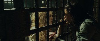 Movie still from “Pirates of the Caribbean: Dead Man's Chest” (2006), directed by Gore Verbinski – A man and a woman in a jail cell; Close Up shot, High angle