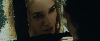 Movie still from “Pirates of the Caribbean: Dead Man's Chest” (2006), directed by Gore Verbinski – A woman's face as she looks into the camera; Close Up shot, Over the shoulder angle
