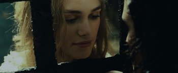 Movie still from “Pirates of the Caribbean: Dead Man's Chest” (2006), directed by Gore Verbinski – A person looking at a mirror; Close Up shot, Over the shoulder angle