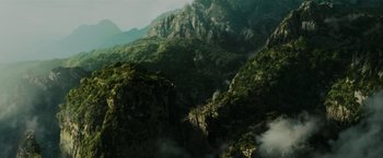 Movie still from “Pirates of the Caribbean: Dead Man's Chest” (2006), directed by Gore Verbinski – A view of a mountain range from a helicopter; Extreme Wide shot, High angle