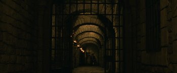 Movie still from “Pirates of the Caribbean: Dead Man's Chest” (2006), directed by Gore Verbinski – A tunnel with a brick wall in the middle of it; Extreme Wide shot, Low angle
